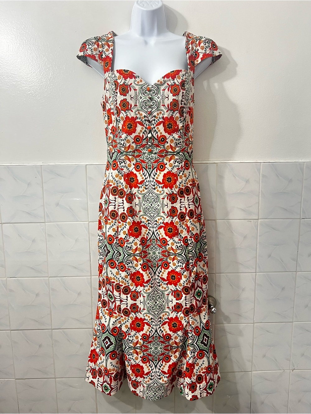 The Cecily fit and flare sweetheart from Anthropologie in orange motif